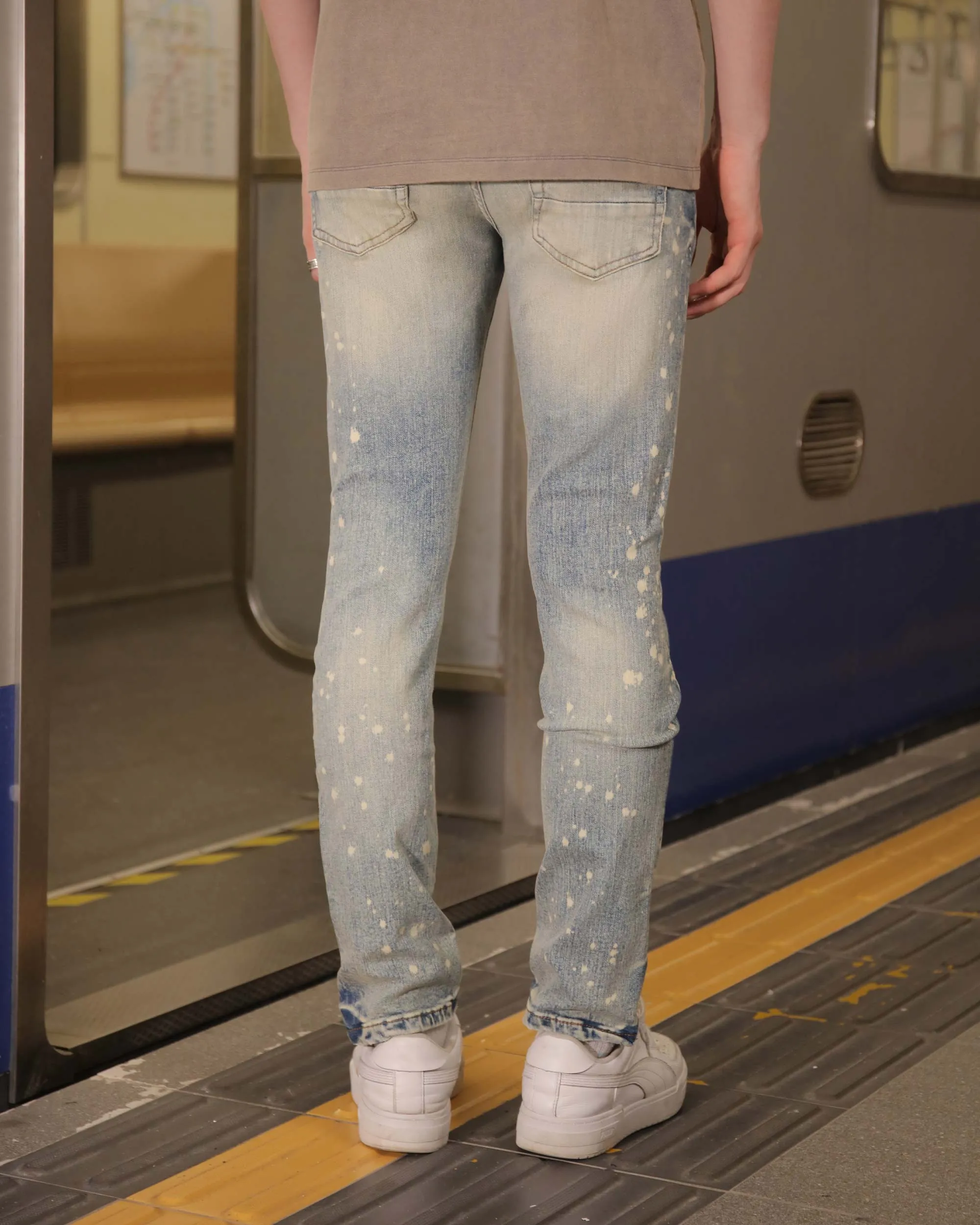 Distressed Whiskered Blue Ripped Jeans with Spray Paint Accents