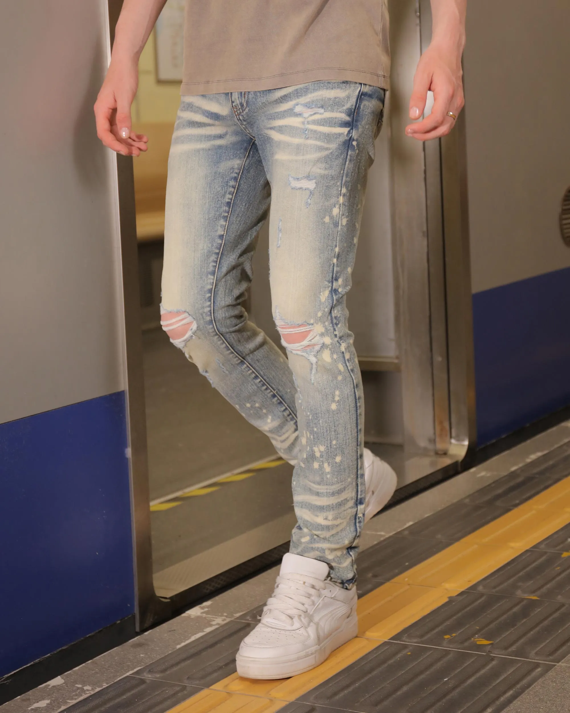Distressed Whiskered Blue Ripped Jeans with Spray Paint Accents