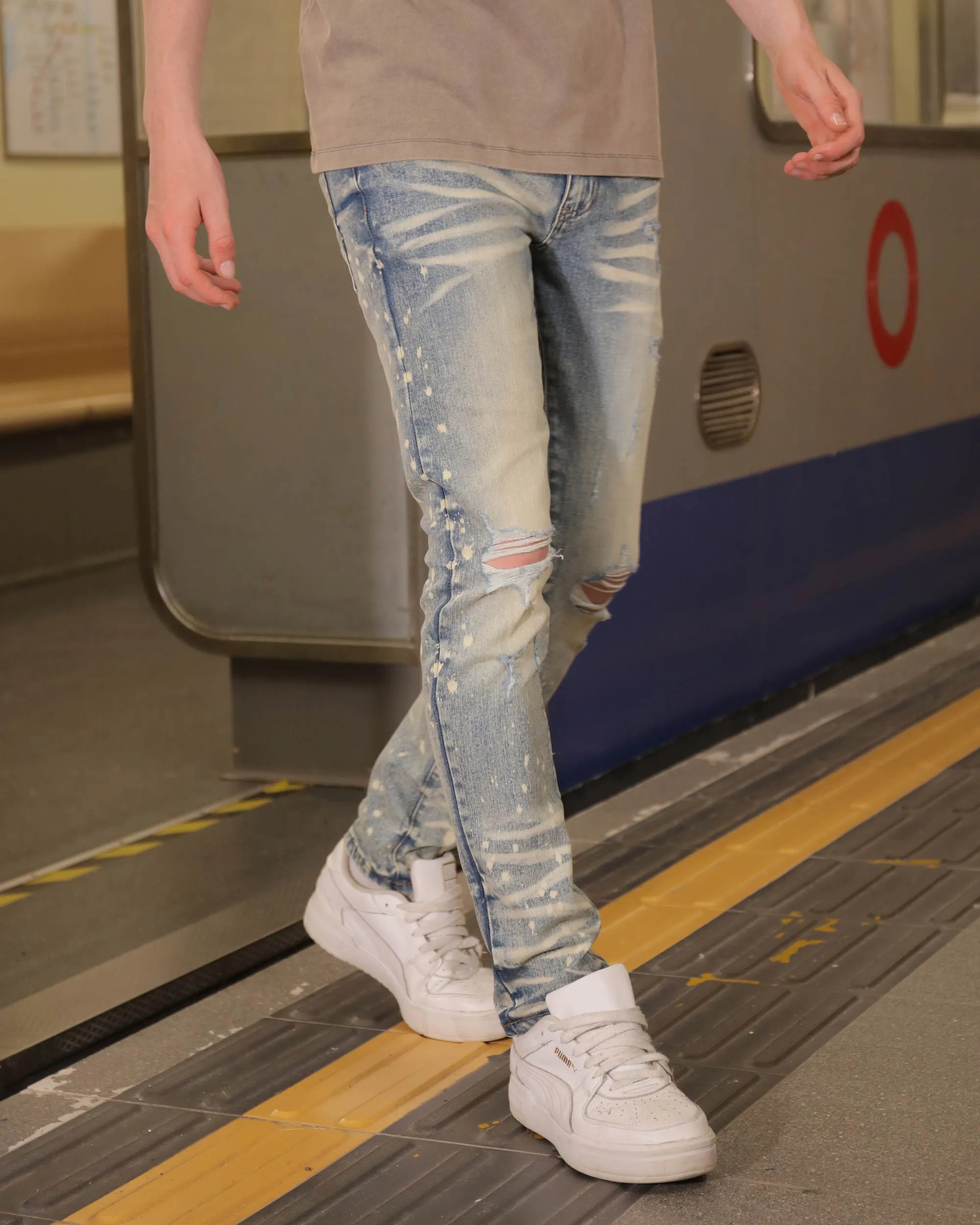 Distressed Whiskered Blue Ripped Jeans with Spray Paint Accents