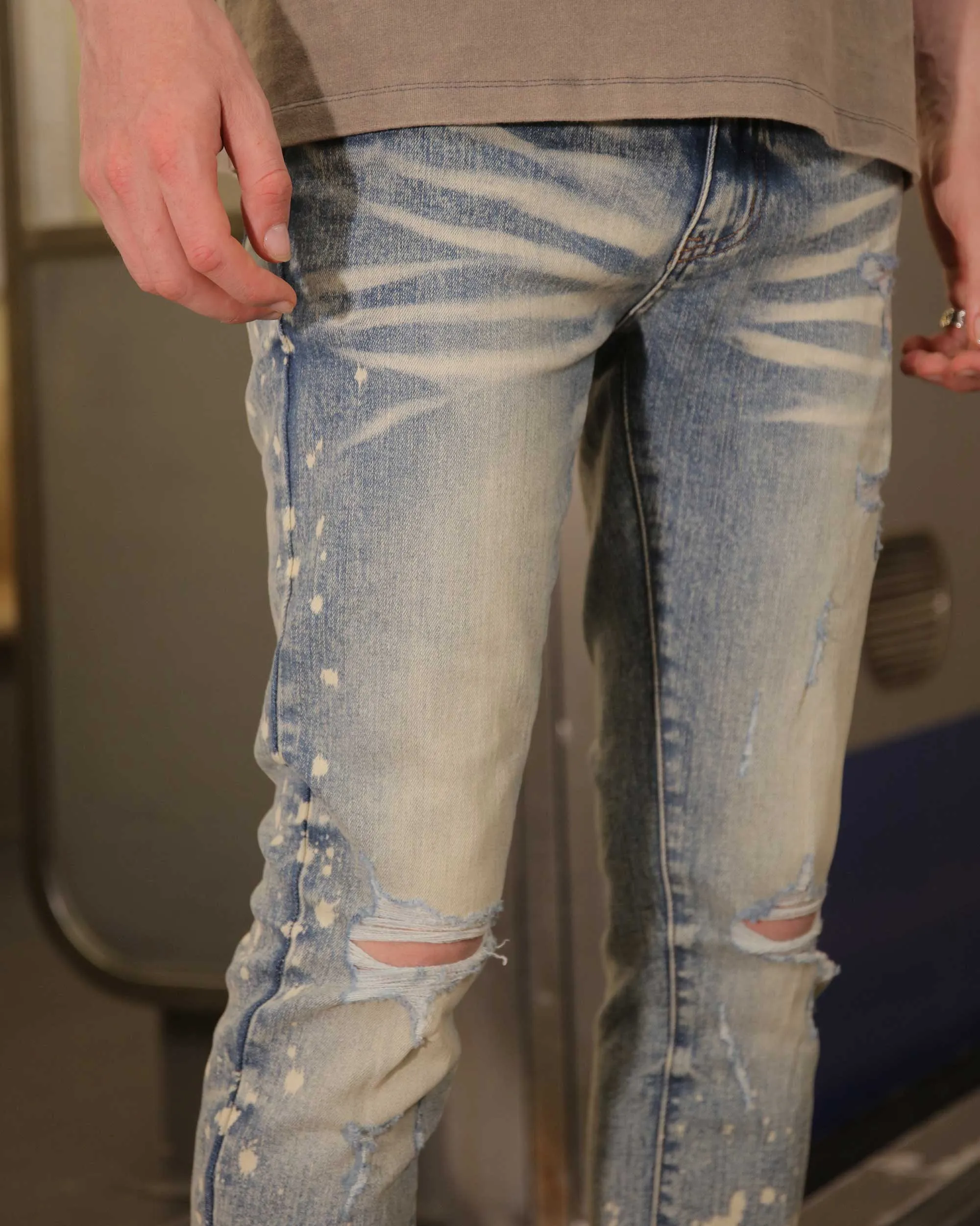 Distressed Whiskered Blue Ripped Jeans with Spray Paint Accents